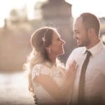 The image captures the emotional moment of the vintage-inspired couple sharing a heartfelt gaze by t.