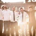 The image captures the warmth and camaraderie of the vintage-inspired gathering.