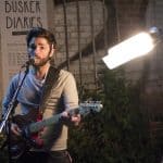 The emotional moment captures the vintage vibe of the intimate live music setting.