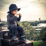 The vintage style captures the innocence and wonder of childhood in a classic setting.