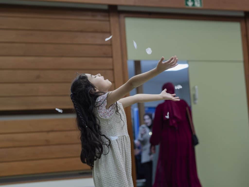 The vintage style captures a heartfelt moment of innocence and celebration.