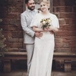 The vintage-style wedding photo captures the timeless love and joy of the couple on their special da.