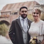 The emotional moment captures the timeless love of the couple in the vintage-inspired setting.