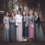 The image captures the warmth and elegance of the vintage-inspired women’s dresses, perfect for spec.